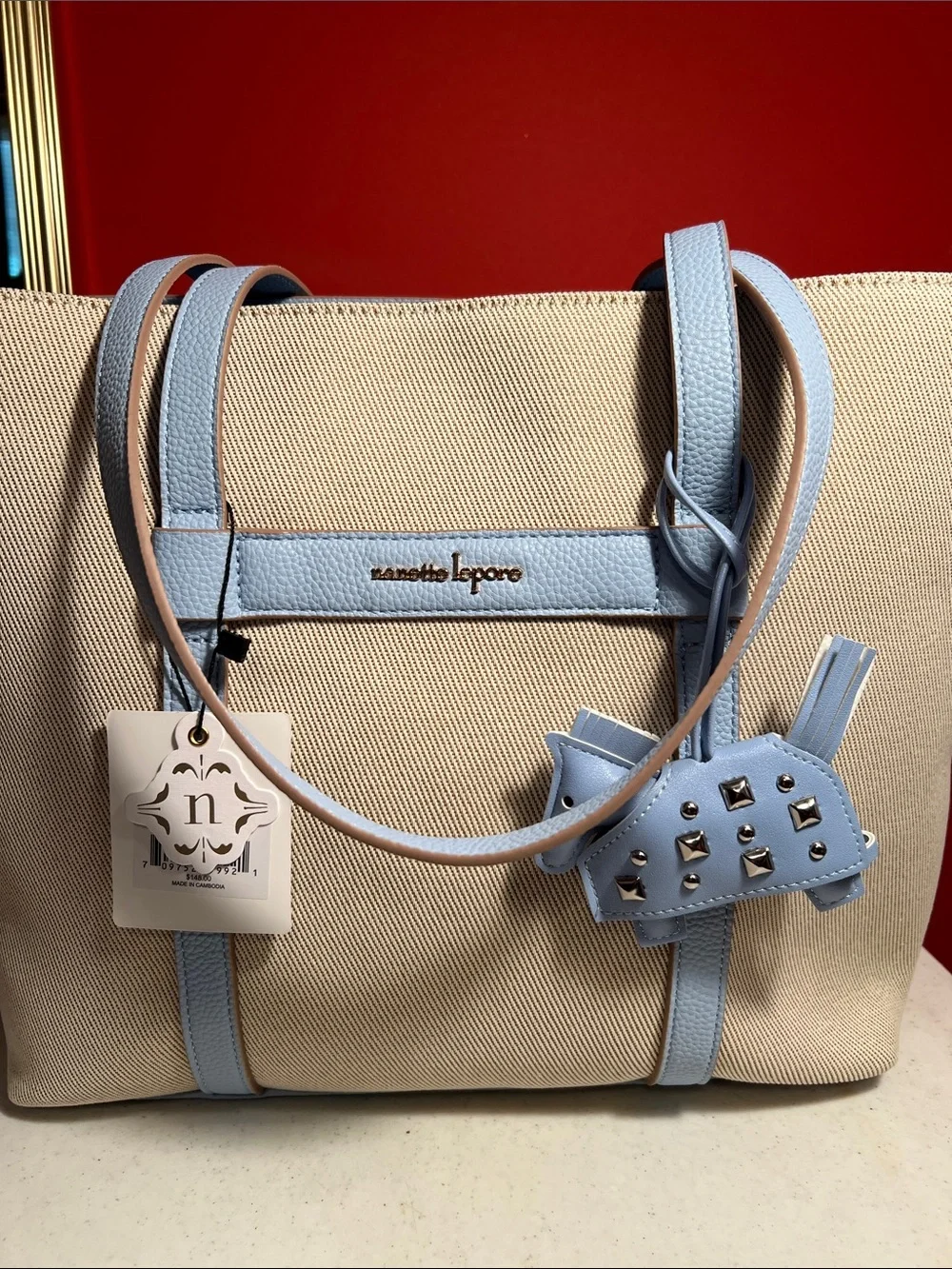 Nanette Lepore Beige Canvas Tote with Light Blue Leather Trim and Charm  RT,148